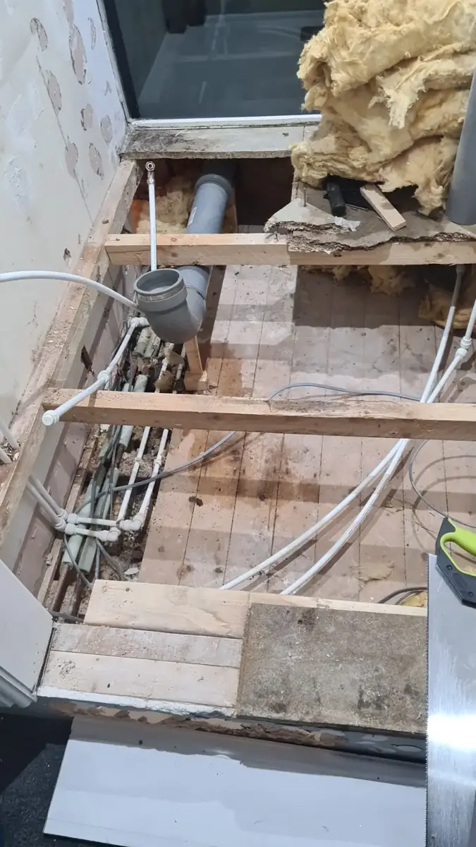 Floor opened to access the plumbing