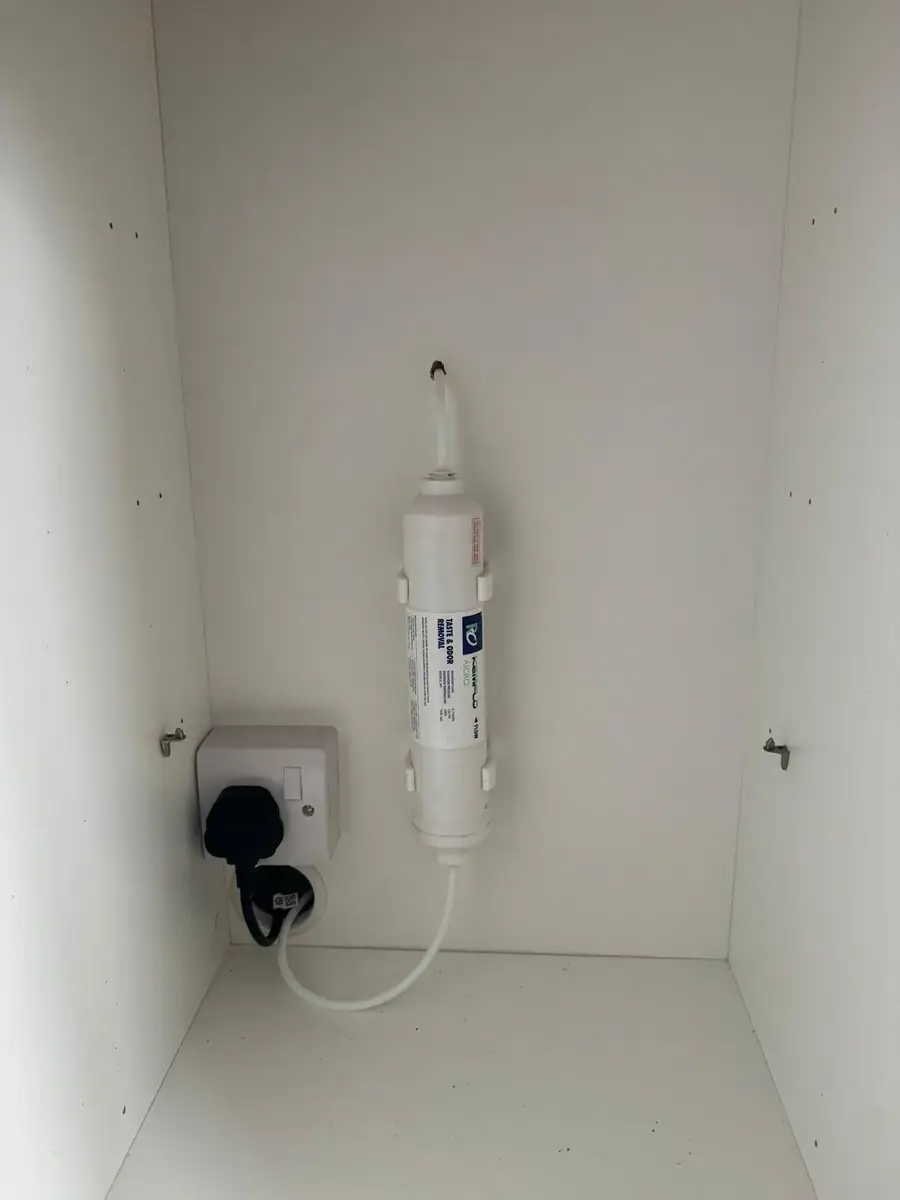 Fridge water filter fitted inside the cupboard