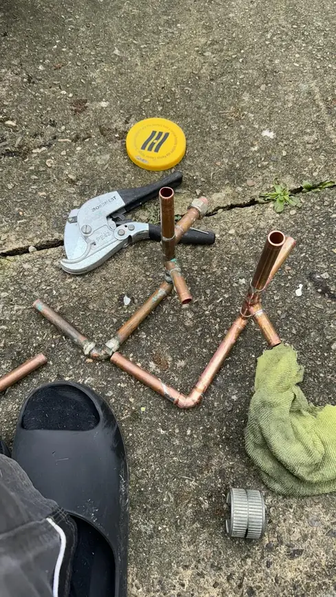 Copper pipe sections from the leak repair